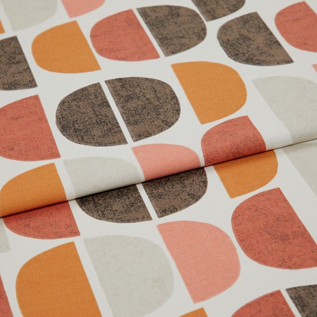 A folded piece of fabric with Burt Rust Orange printed on it