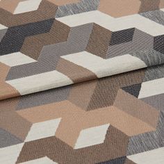 A folded piece of fabric with Connect Ember Natural printed on it