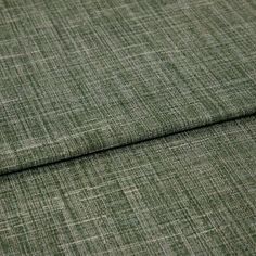 A folded piece of fabric with Haddie Aspen Light Green printed on it