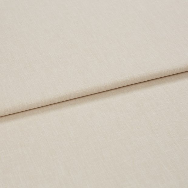 A folded piece of fabric with Harper Almond Cream printed on it