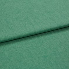 A folded piece of fabric with Harper Jade Light Green printed on it