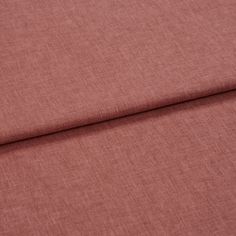A folded piece of fabric with Harper Punch Pink printed on it