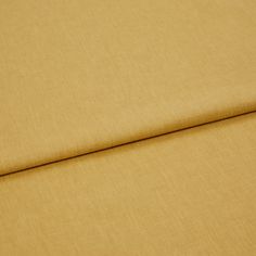 A folded piece of fabric with Harper Sunshine Yellow printed on it