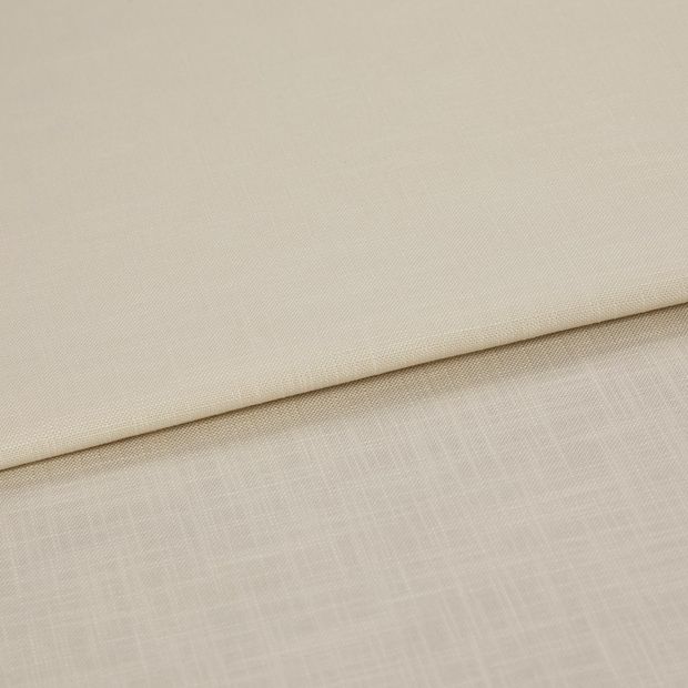 A folded piece of fabric with Faso Whisper Cream printed on it