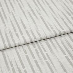 A folded piece of fabric with Flourish Silver printed on it