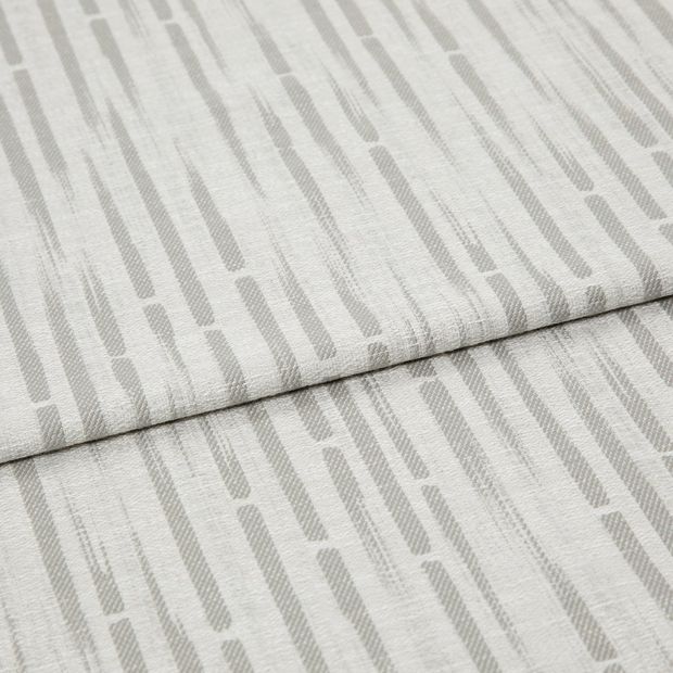 A folded piece of fabric with Flourish Silver printed on it