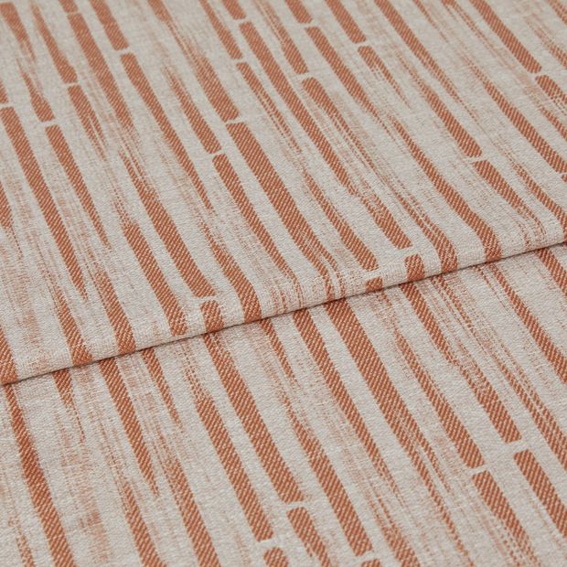 A folded piece of fabric with Flourish Sunflower Orange printed on it