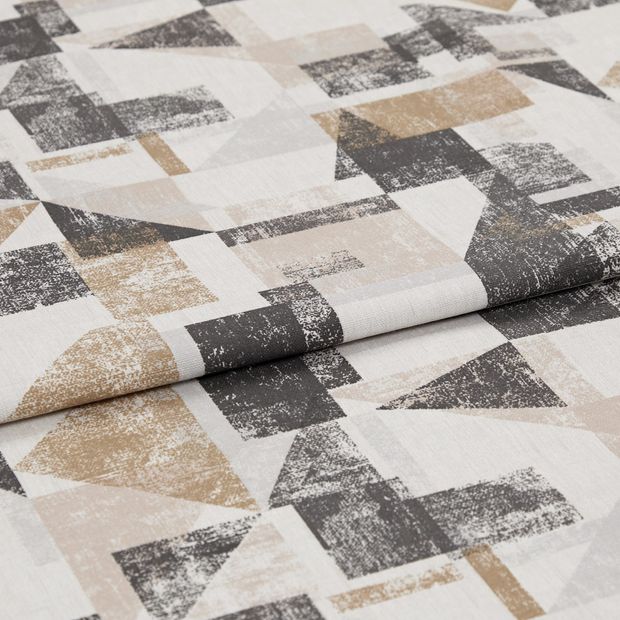 A folded piece of fabric with Fraction Amber Gold printed on it