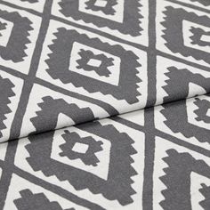 A folded piece of fabric with Mali Peat Black printed on it