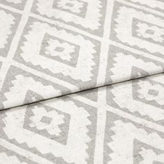 A folded piece of fabric with Mali Silver printed on it