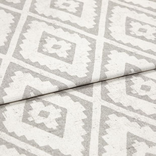 A folded piece of fabric with Mali Silver printed on it