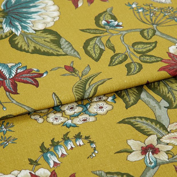 A folded piece of fabric with Manisha Golden Yellow printed on it