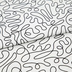 A folded piece of fabric with Matisse Mono Black & White printed on it