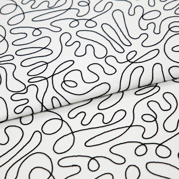 A folded piece of fabric with Matisse Mono Black & White printed on it