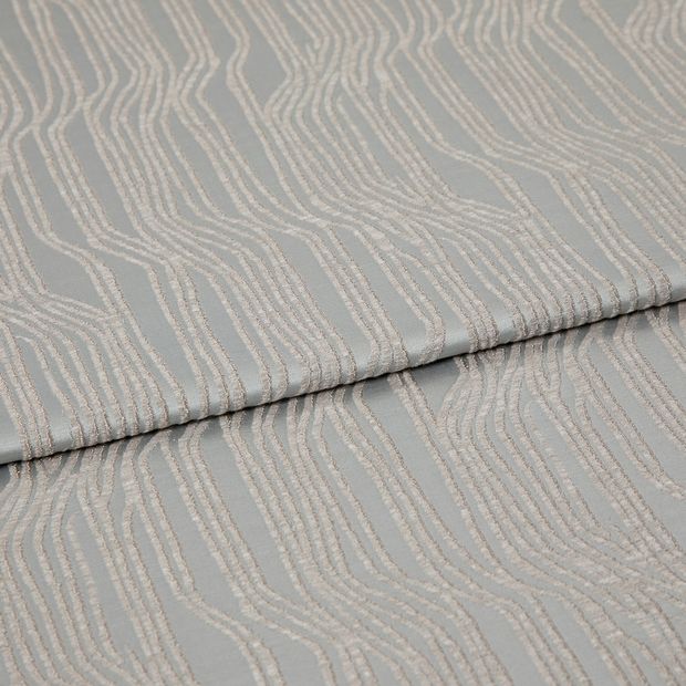 A folded piece of fabric with Maud Mineral Silver printed on it