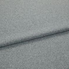 A folded piece of fabric with Huxley Charcoal Grey printed on it
