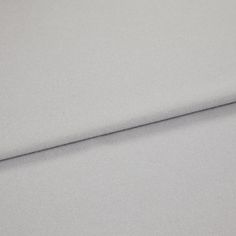 A folded piece of fabric with Huxley Dove Grey Silver printed on it