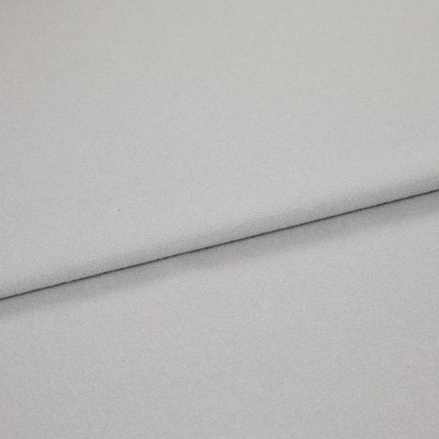 A folded piece of fabric with Huxley Dove Grey Silver printed on it