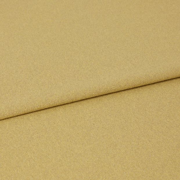 A folded piece of fabric with Huxley Honey Yellow printed on it