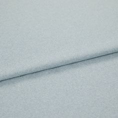 A folded piece of fabric with Huxley Powder Blue printed on it