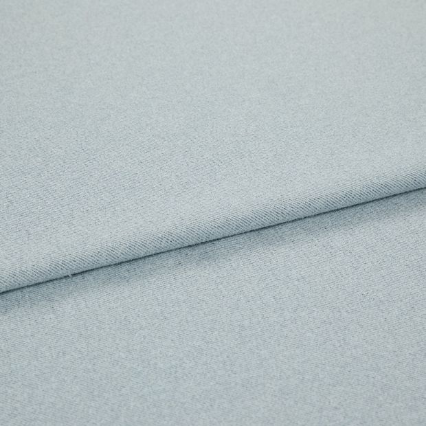 A folded piece of fabric with Huxley Powder Blue printed on it