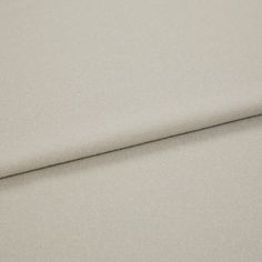 A folded piece of fabric with Huxley Sandbar Silver printed on it