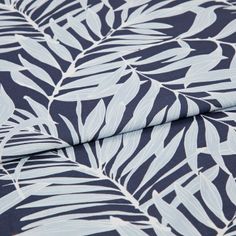 A folded piece of fabric with Laurel Infinity Navy printed on it