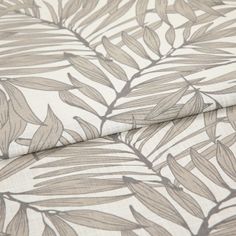 A folded piece of fabric with Laurel Pumice Cream printed on it