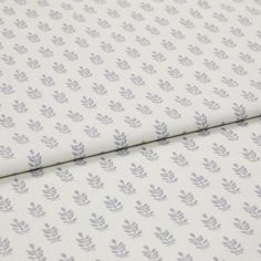 A folded piece of fabric with Layla Smoke Silver printed on it