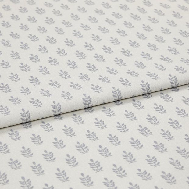A folded piece of fabric with Layla Smoke Silver printed on it