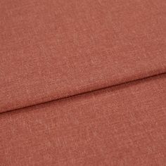 A folded piece of fabric with Lindora Sienna Orange printed on it