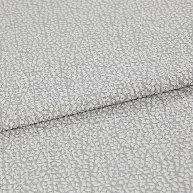 A folded piece of fabric with Maxwell Lunar Silver printed on it