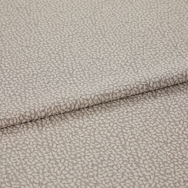 A folded piece of fabric with Maxwell Mink Cream printed on it