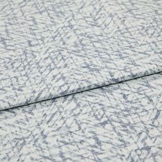 A folded piece of fabric with Morse Blue printed on it