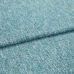 A folded piece of fabric with Paloma Aqua Teal printed on it