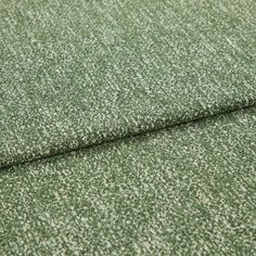 A folded piece of fabric with Paloma Moss Green printed on it