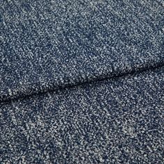 A folded piece of fabric with Paloma Navy Blue printed on it