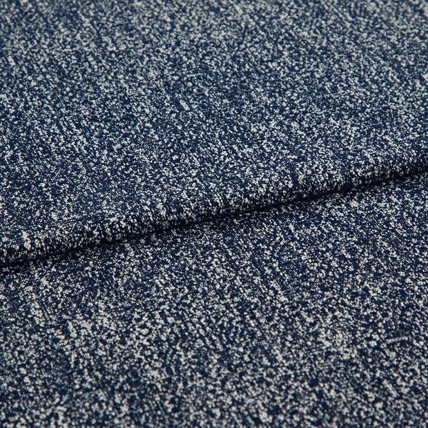 A folded piece of fabric with Paloma Navy Blue printed on it