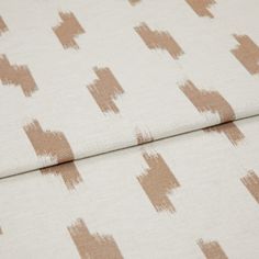 A folded piece of fabric with Patara Sandstorm Orange printed on it