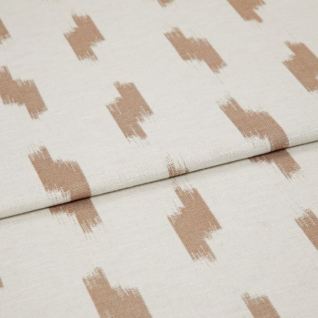 A folded piece of fabric with Patara Sandstorm Orange printed on it