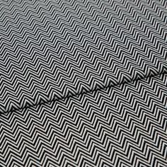 A folded piece of fabric with Pippa Jet Grey printed on it
