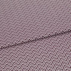 A folded piece of fabric with Pippa Purple printed on it