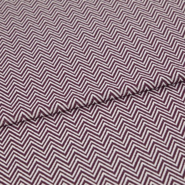 A folded piece of fabric with Pippa Purple printed on it