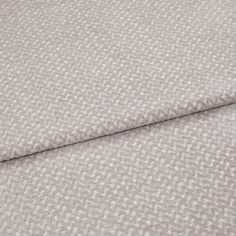 A folded piece of fabric with Wave Stone Cream printed on it