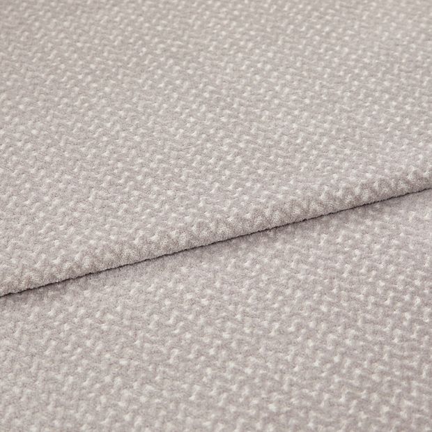A folded piece of fabric with Wave Stone Cream printed on it