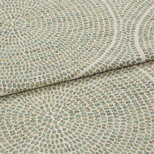 A folded piece of fabric with Zane Aspen Light Green printed on it