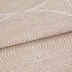 A folded piece of fabric with Zane Tuscany Orange printed on it