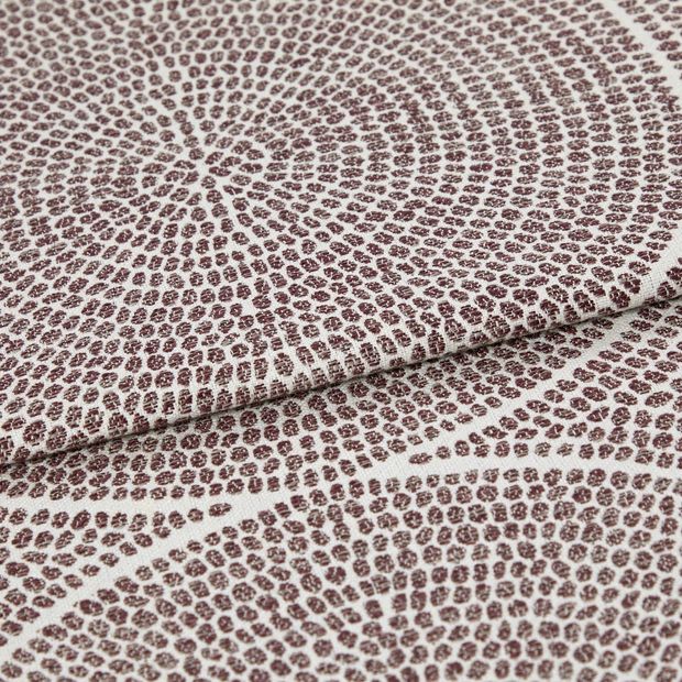 A folded piece of fabric with Zane Wineberry Purple printed on it