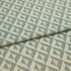 A folded piece of fabric with Zircon Turquoise Teal printed on it