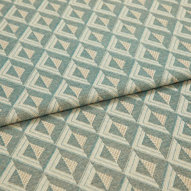 A folded piece of fabric with Zircon Turquoise Teal printed on it
